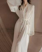 Darette Late Start Robe in Ivory - long satin robe with lace cuffs and a tied sash, front view