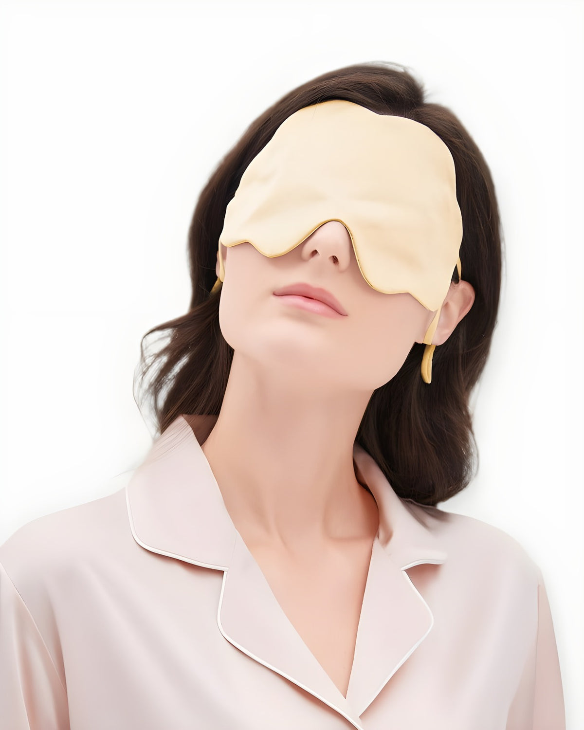 Darette Lights Out Silk Eye Mask in Champagne worn by a model in silk pajamas, front view
