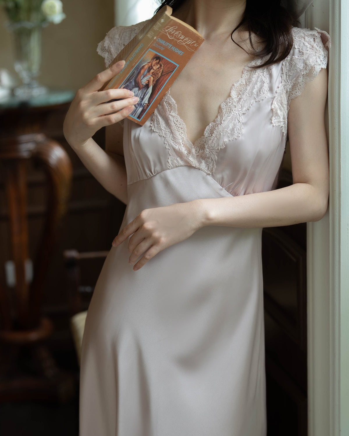 Darette Long Story Slip in Mauve - front view holding a book, showing the lace V-neck bodice