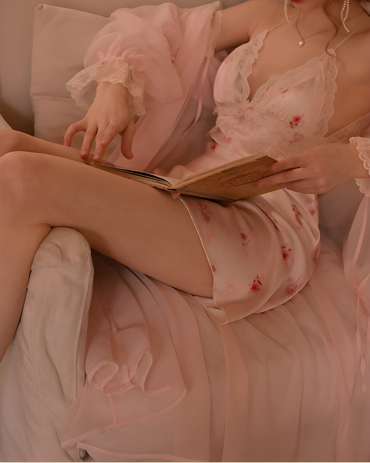 Darette Loose Ends Slip in Blush - front view reclining on a chair with a book, wearing a matching robe