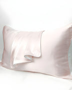 Close-up of the Darette Night Shift Silk Pillowcase in Blush, showing the satin sheen and folded corner