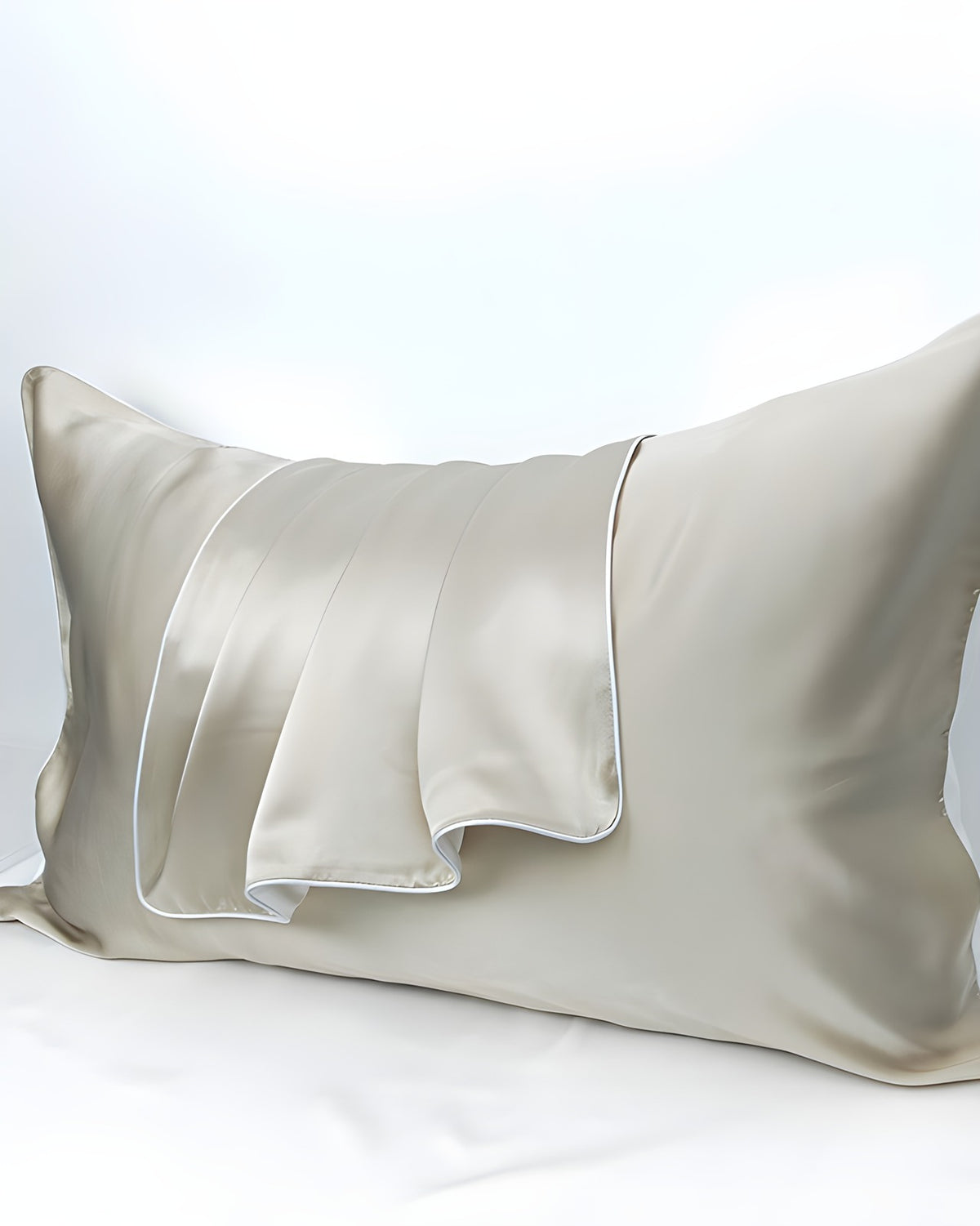 Darette Night Shift Silk Pillowcase in Crème on a plain background, showing the satin finish