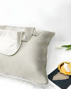Darette Night Shift Silk Pillowcase in Crème styled with a tulip and magazine, folded corner detail