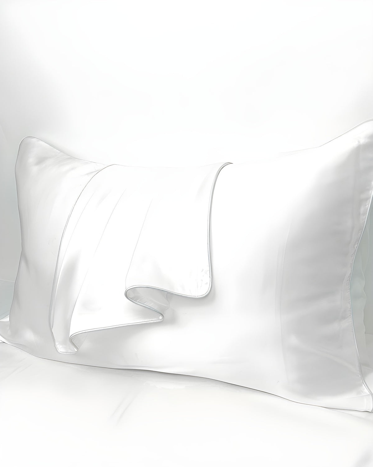 Darette Night Shift Silk Pillowcase in Ivory on a plain background, showing the smooth satin surface