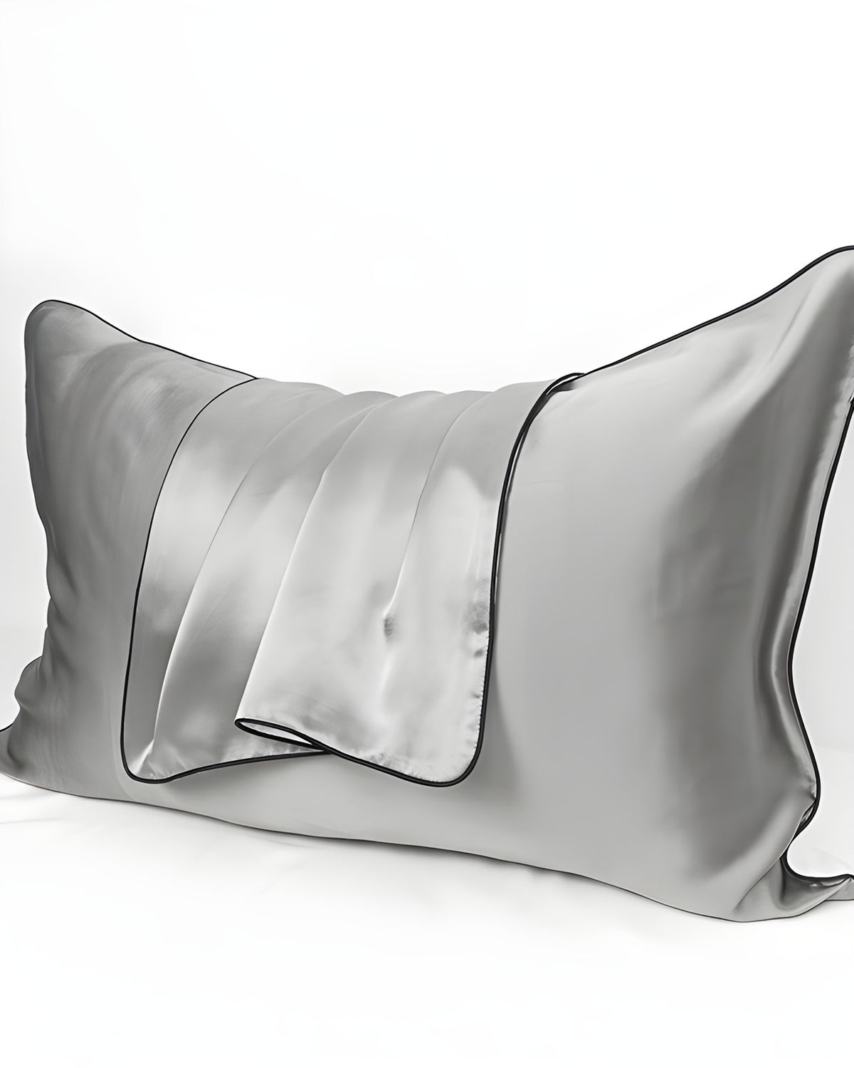 Darette Night Shift Silk Pillowcase in Mist on a plain background, showing the contrast piping trim
