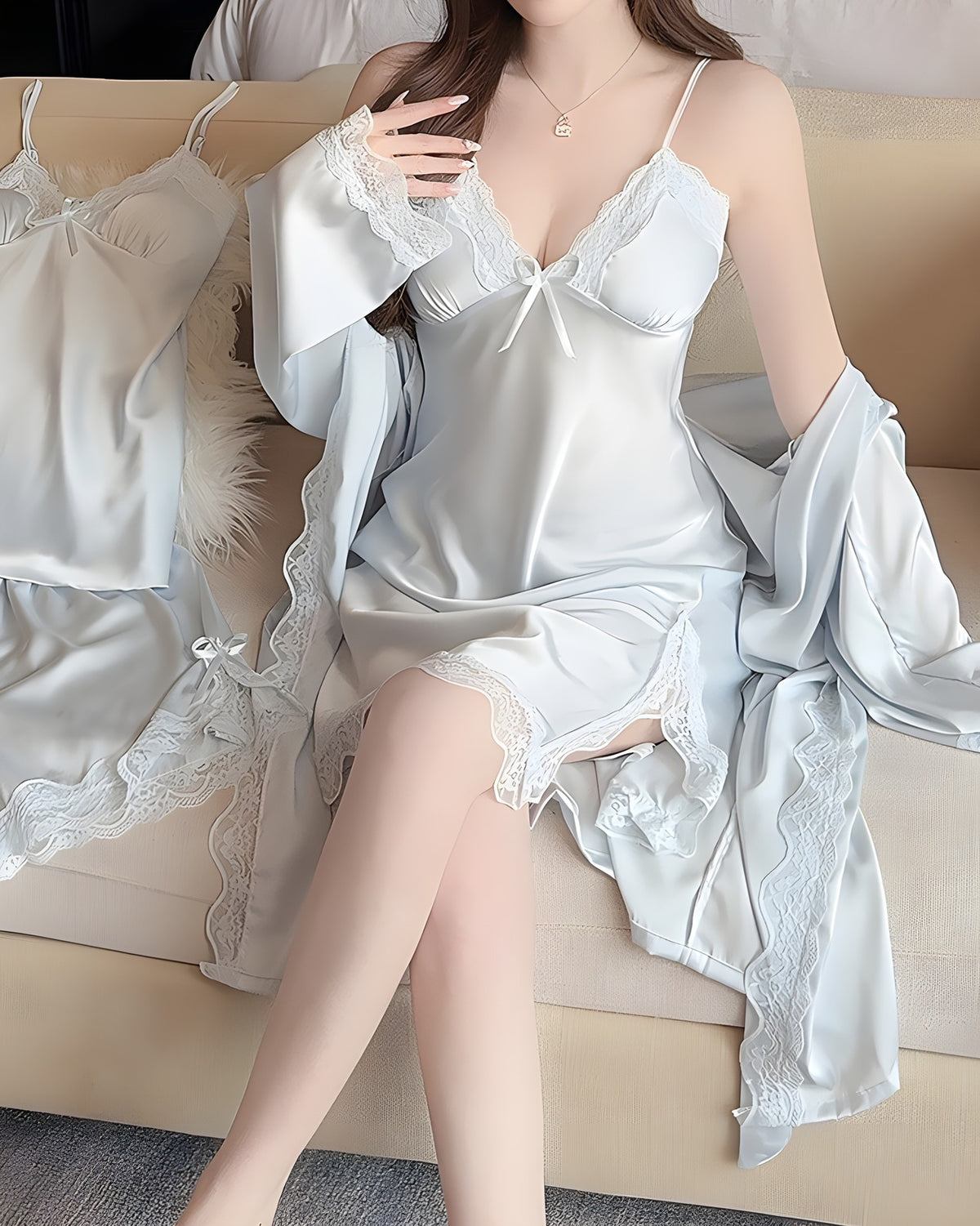 Darette Nightcap Set in Sky - front view seated on the sofa with a book, wearing the feather-trim robe