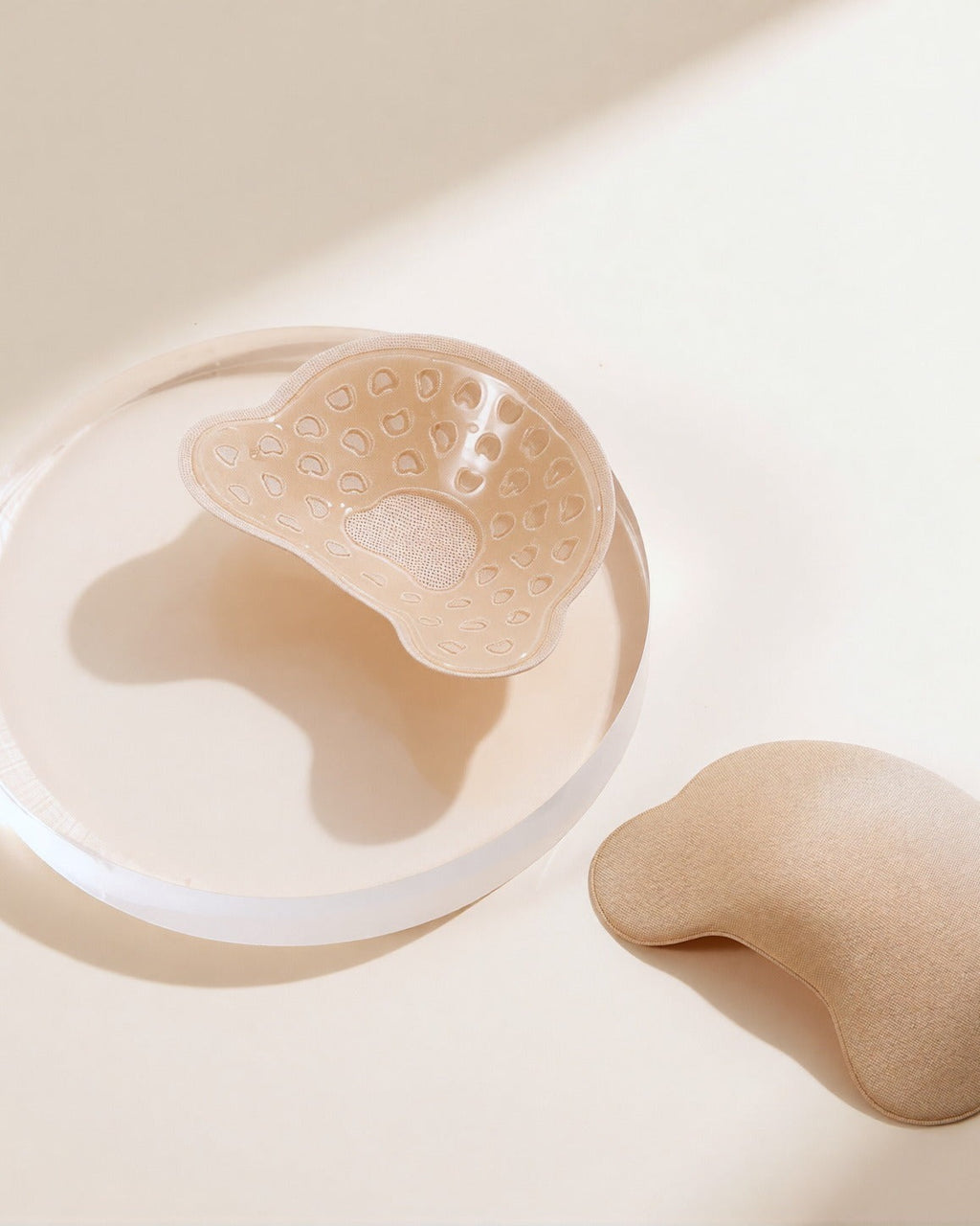Darette Off the Record Covers in Nude - cover resting beside a small round mirror dish