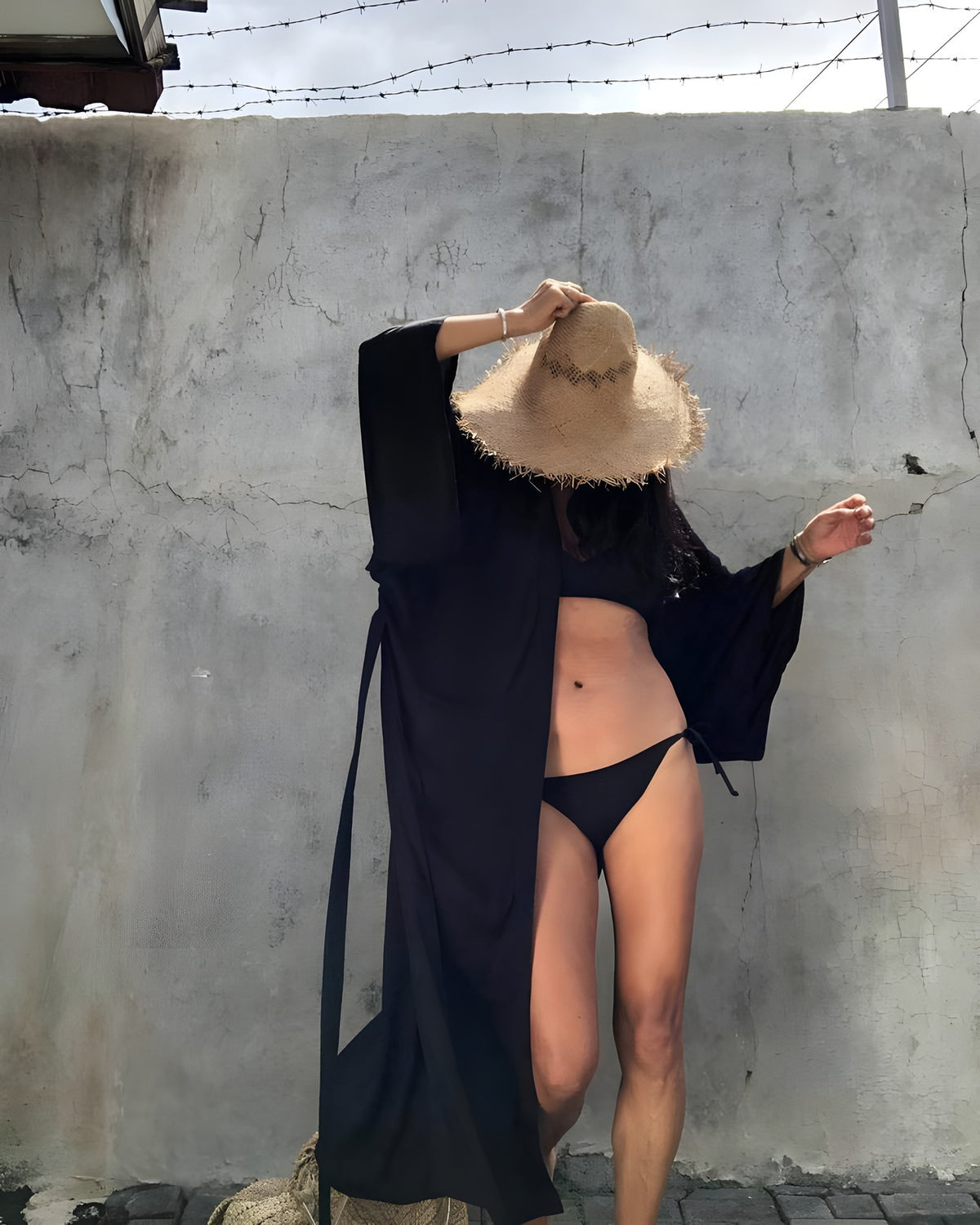 Darette Out of Office Cover-Up in Noir - robe worn open over a bikini, styled with a straw hat