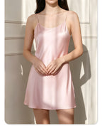 Darette Plain English Silk Slip in Blush - front view seated on the floor in the silk slip