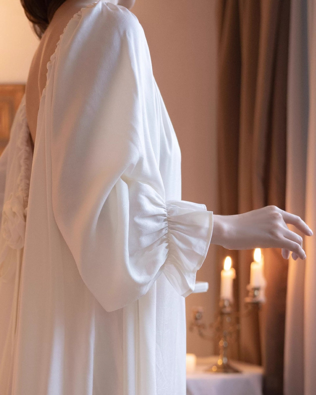 Close-up of the Darette Rose to the Occasion Gown showing the gathered ruffle sleeve cuff