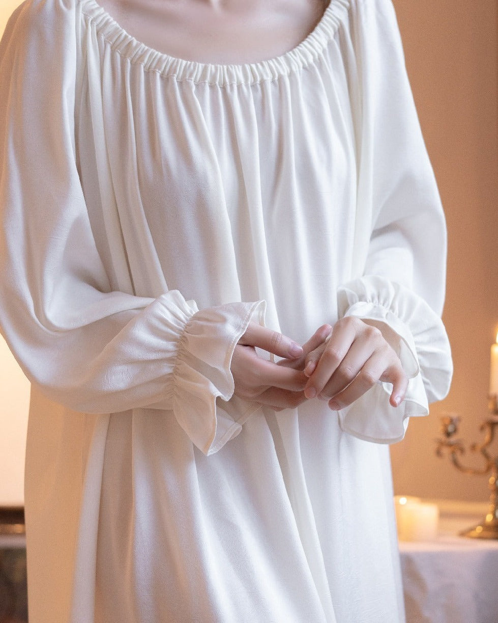 Close-up of the Darette Rose to the Occasion Gown showing the gathered neckline and cuffs