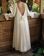 Full length back view of the Darette Rose to the Occasion Gown on an outdoor wooden deck