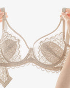 Darette The Confidante Lace Set in Crème - held in hand to show the bunny-ear cup shaping