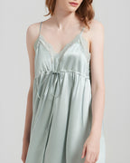 Close-up of the Darette The Real Thing Silk Slip in Sage, showing the lace neckline and drawstring bow