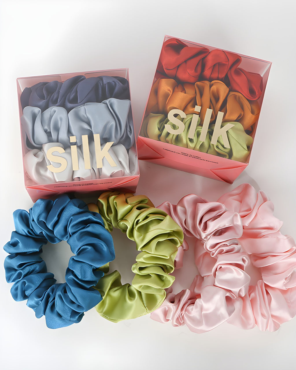 Darette The Understudy Scrunchie Set - two silk scrunchie gift boxes with loose teal, green and pink scrunchies in front