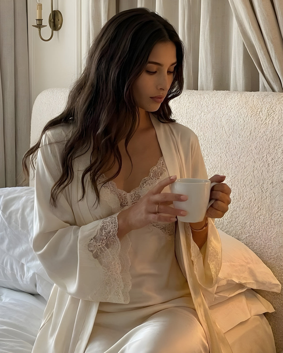 Darette Two Acts Set in Ivory - lace-trimmed robe worn open over the slip gown while holding a teacup